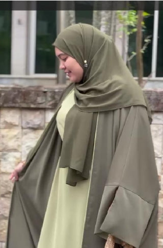 His and Her Harmony: Amir Thobe in Stone Olive Dubai Alia in Pistachio Olive or Sahara Sunset. AL-Zahra in Sage Olive Mist or Jasmine Cocoa