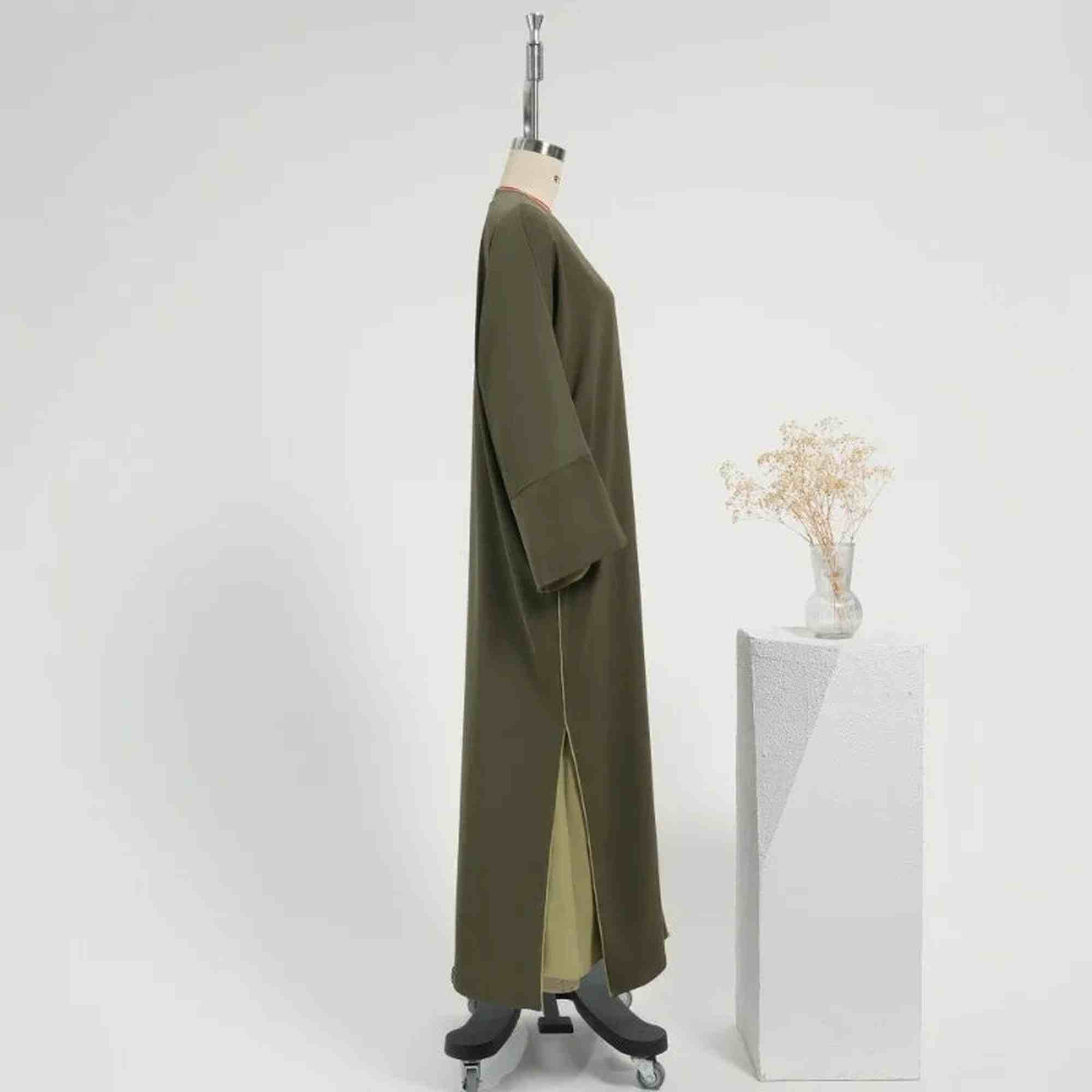 Olive green modest open abaya set with pistachio sleeveless slip dress - side profile - ZAHRA'S BEST