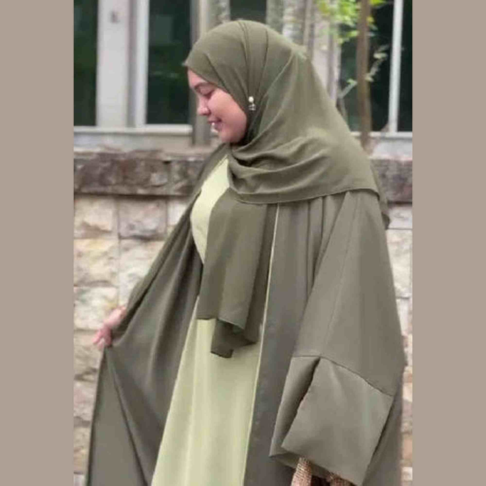 Woman in olive green modest wear and hijab outdoors, ZAHRA'S BEST fashion style