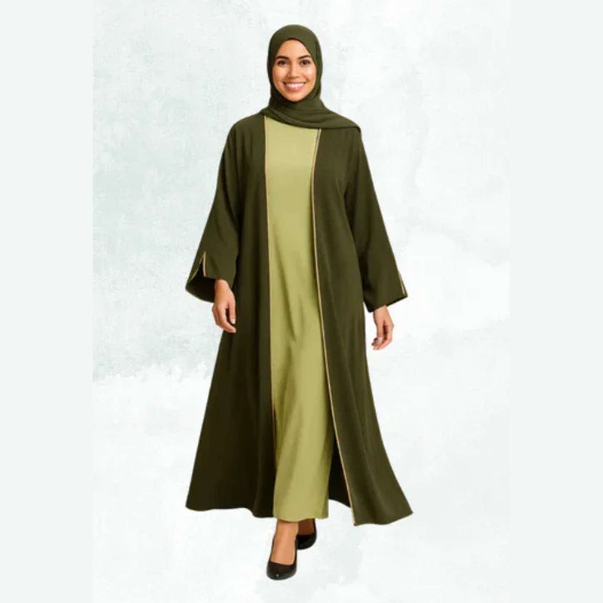 Woman in elegant olive green modest abaya from ZAHRA'S BEST collection, standing and smiling