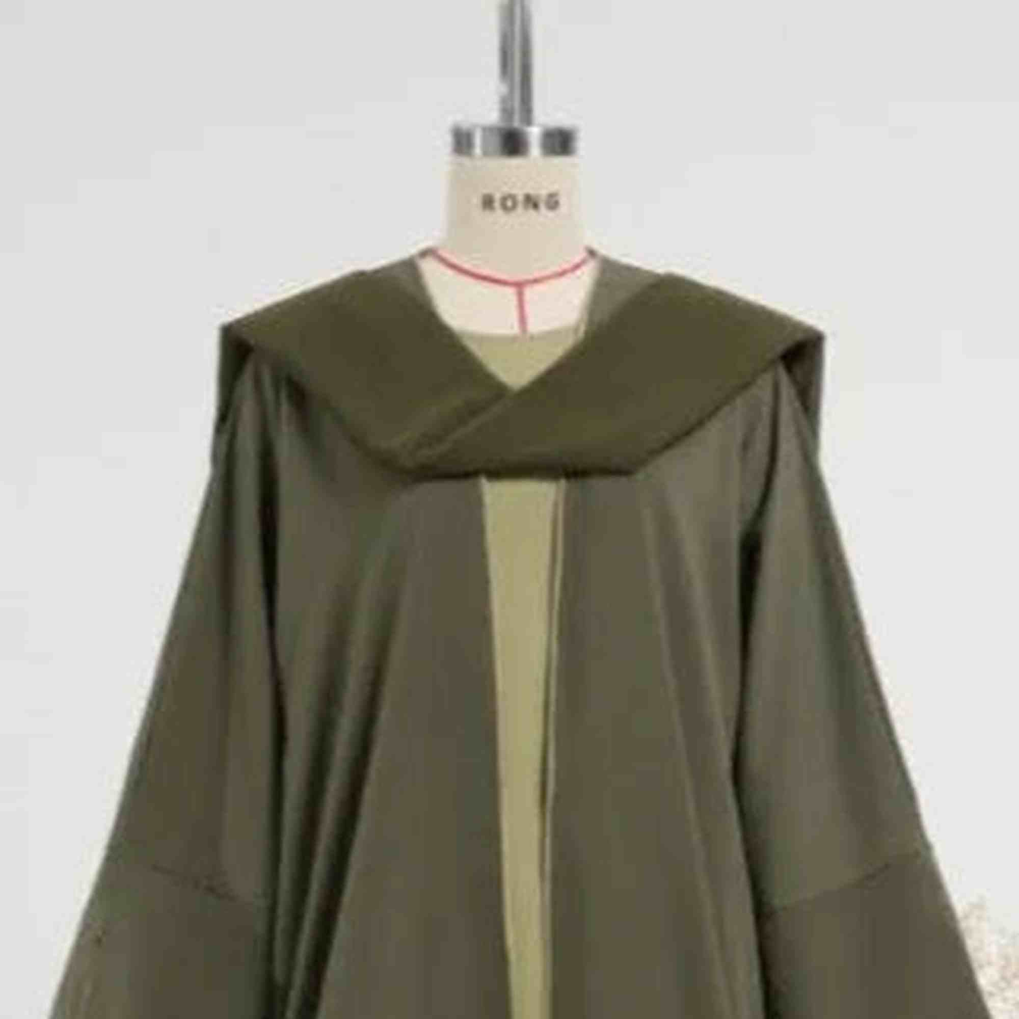 Olive green modest abaya with wide sleeves on mannequin, modern Islamic fashion