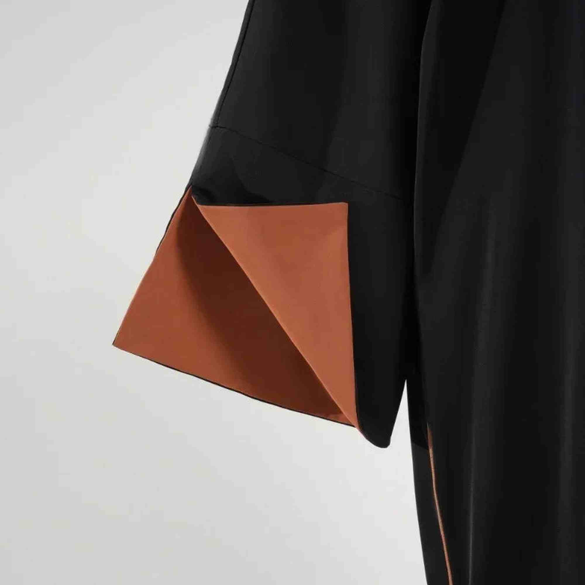 Close-up of a black abaya sleeve with elegant brown lining, Zahra's Best modest fashion